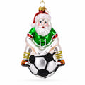 Santa Sitting on Soccer Ball Glass Christmas Ornament